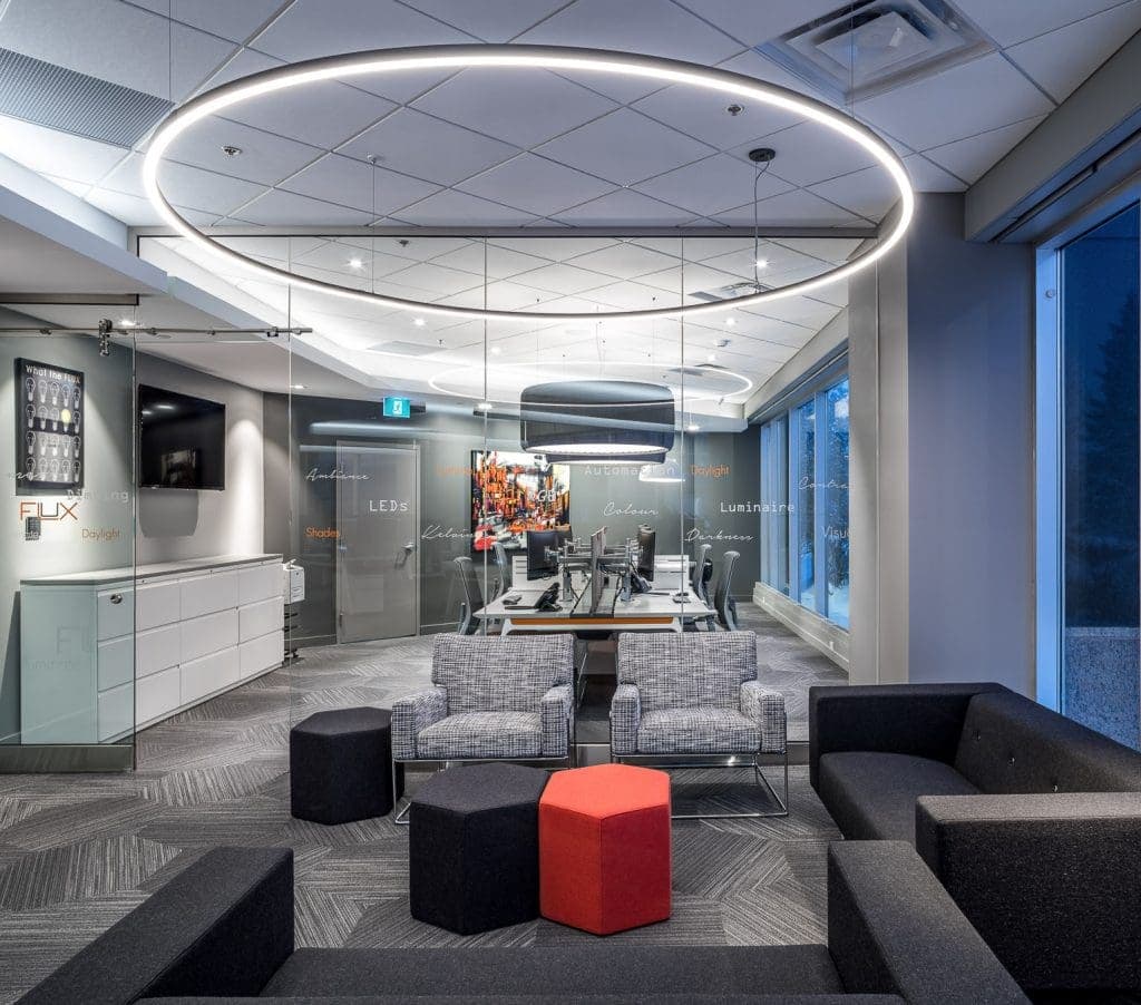 Showroom lighting with circular ring pendant over lounge seating at Flux Lighting, Ottawa