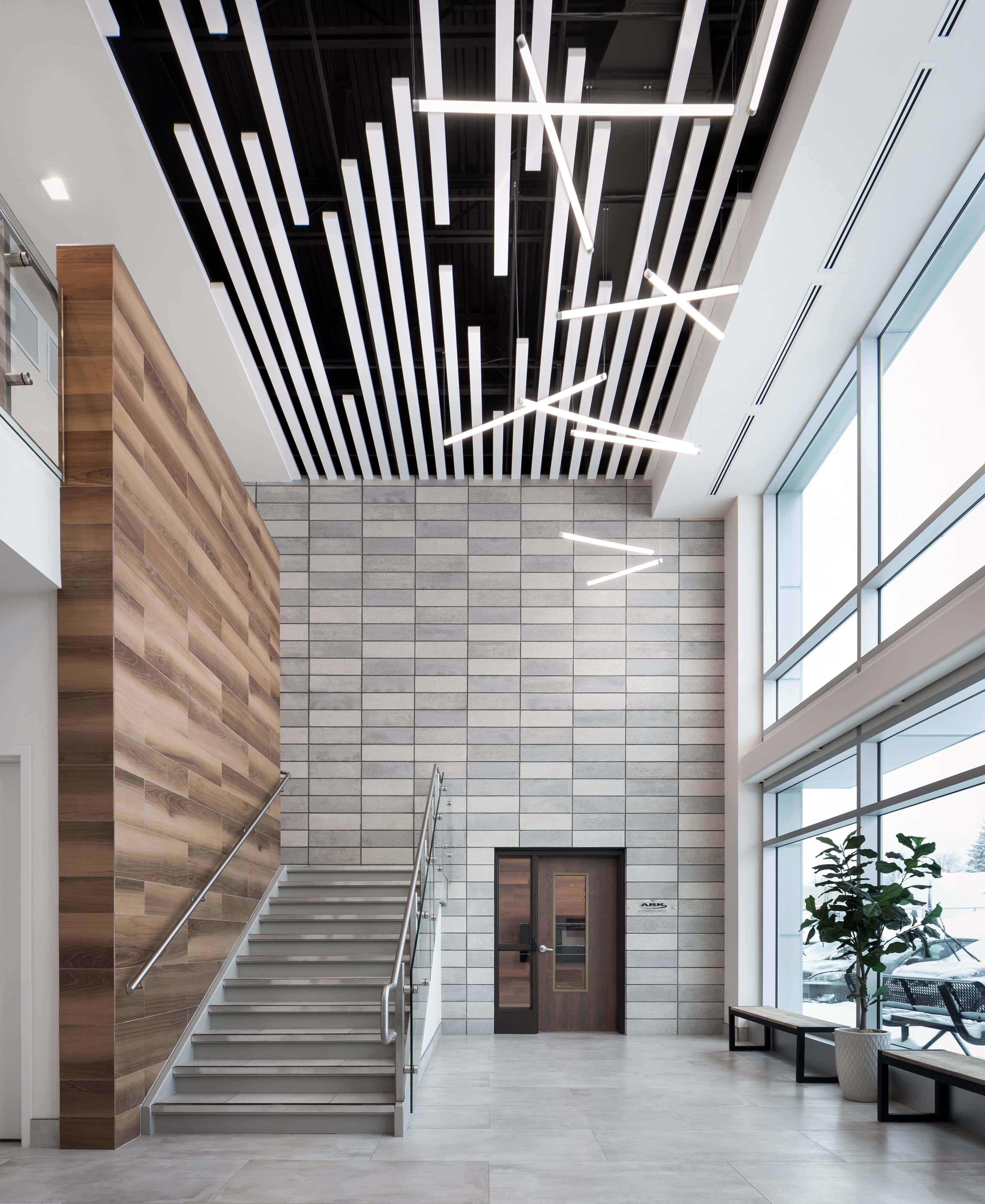Stairwell linear ceiling lighting at Ark Construction, Kanata