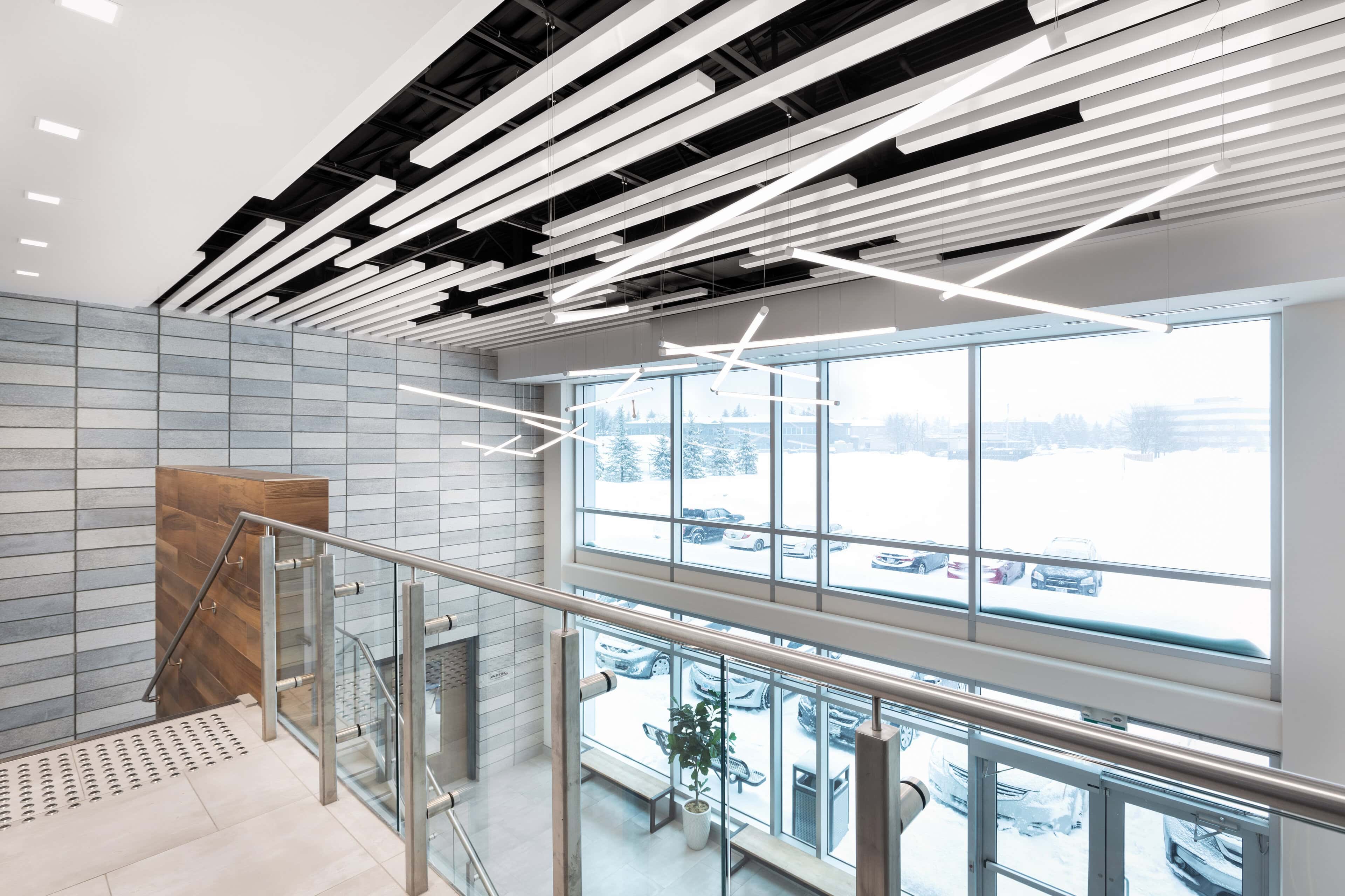 Mezzanine linear ceiling lighting at Ark Construction, Kanata