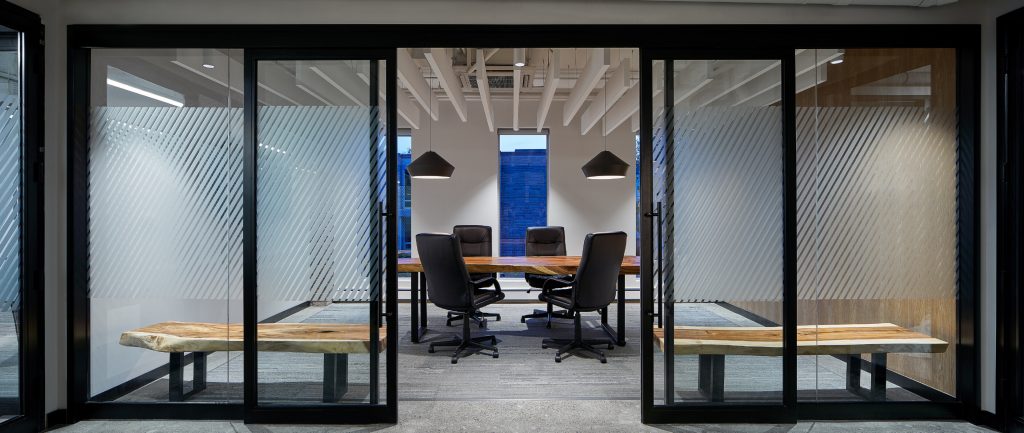 Boardroom lighting with exposed ceiling fixtures at 441 MacLaren, Ottawa