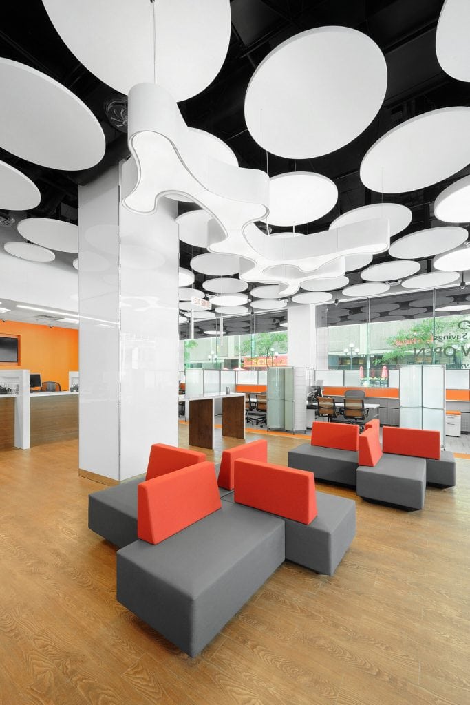 Lounge lighting with sculptural disc ceiling at Alterna Savings, Ottawa