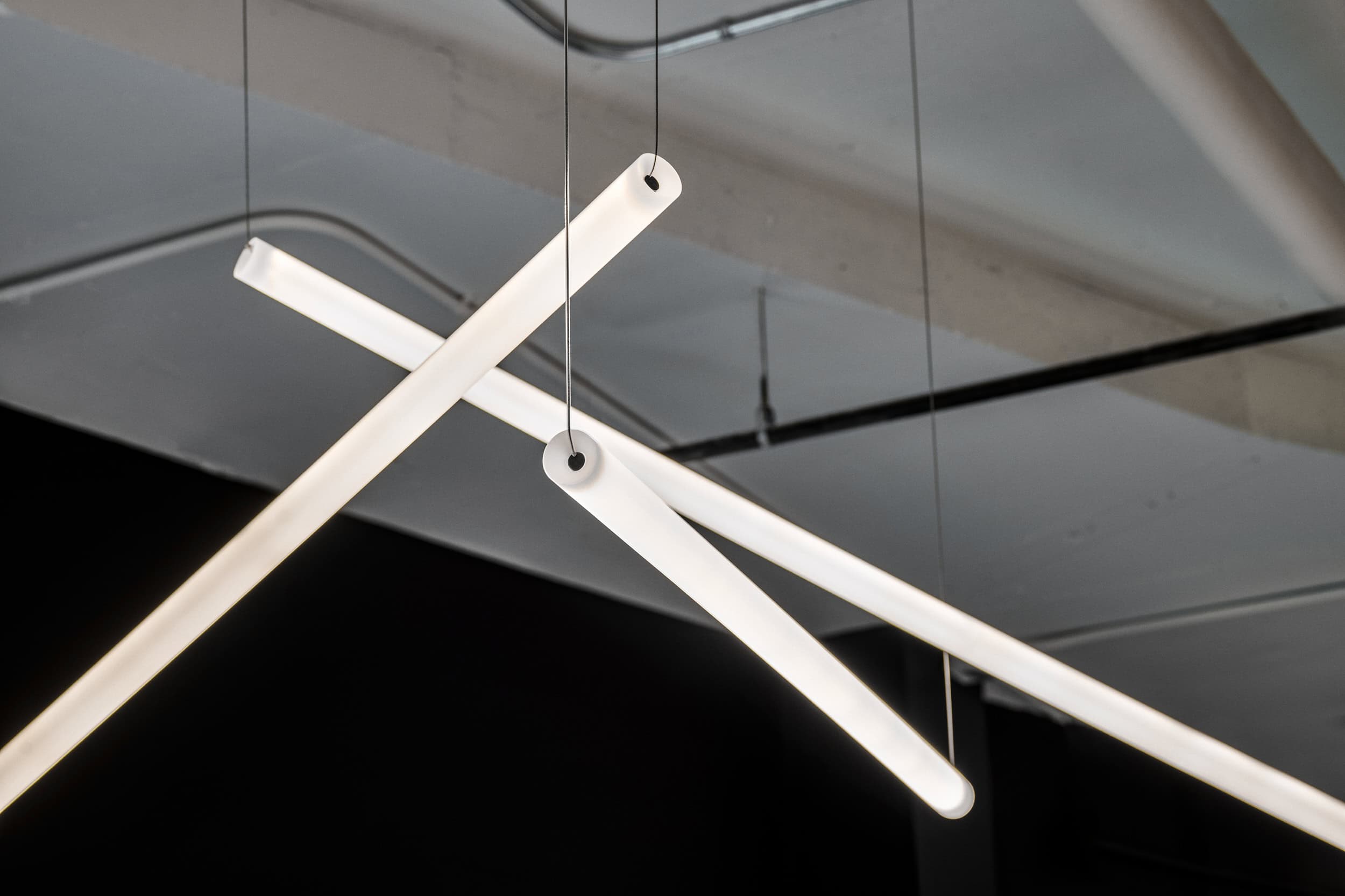 Crossed pendant lighting detail at Mitel, Kanata