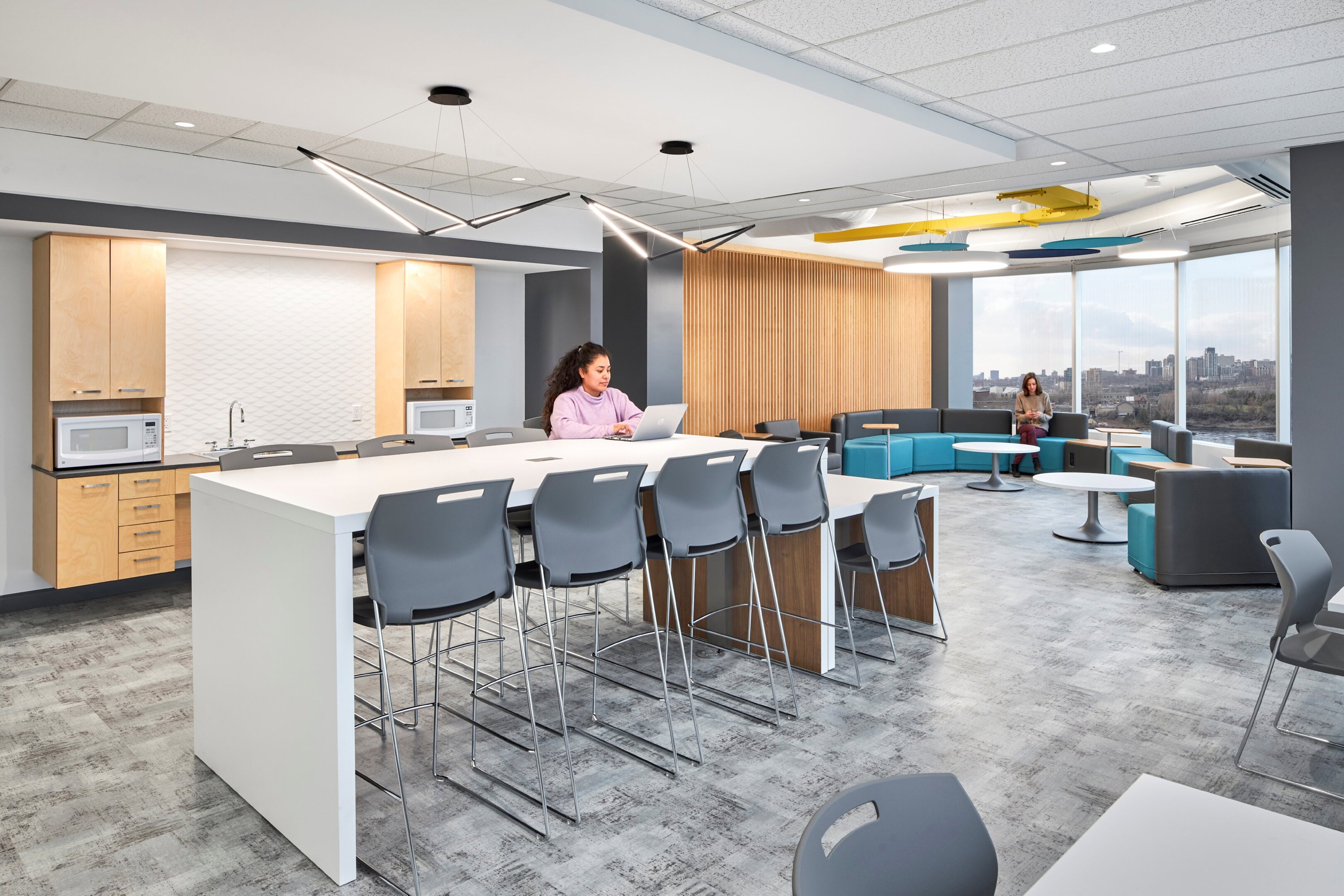 Kitchen lighting with pendant fixtures and decorative ceiling element at GC Workplace, Ottawa