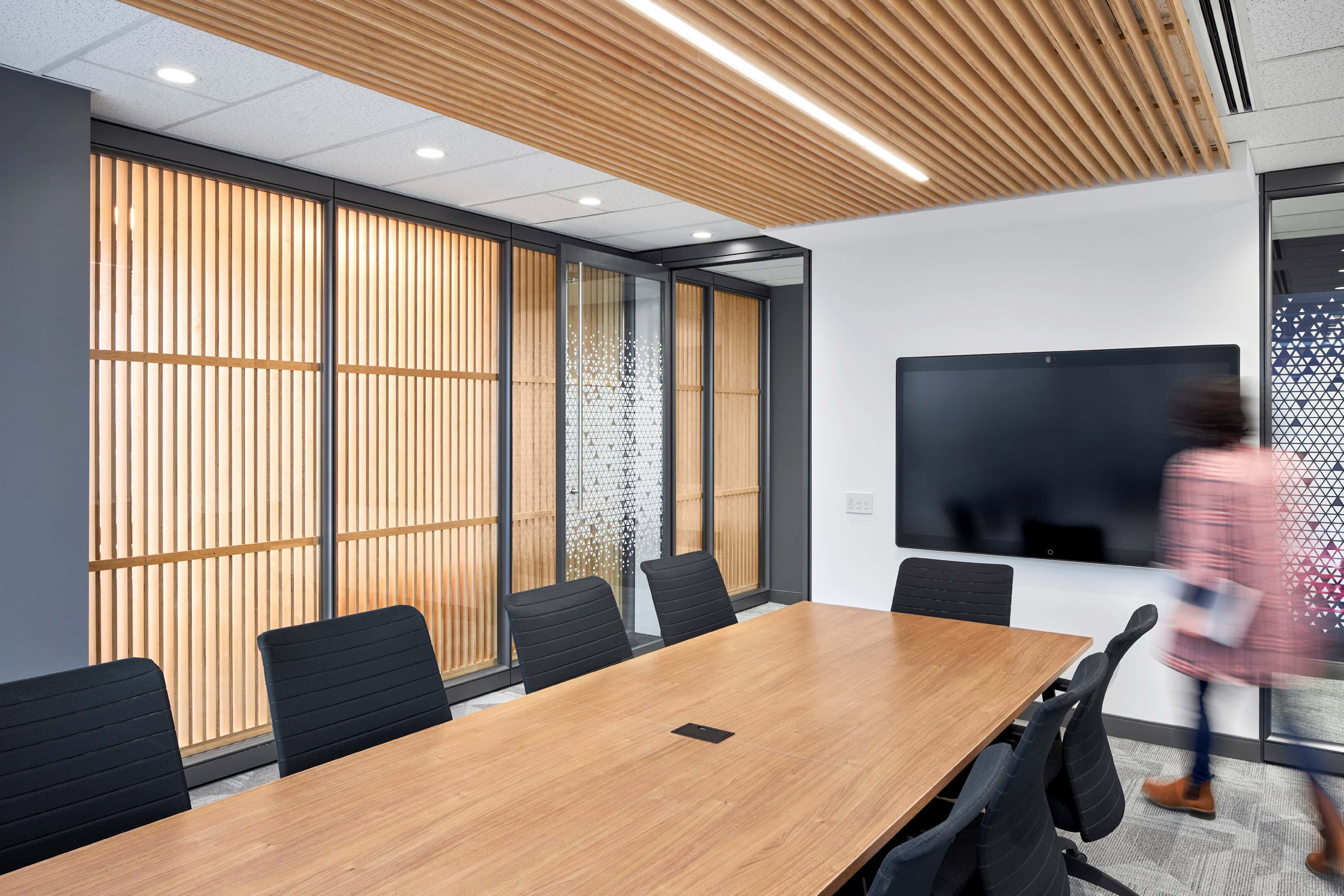Boardroom lighting with cove lighting on wood slat ceiling at GC Workplace, Ottawa