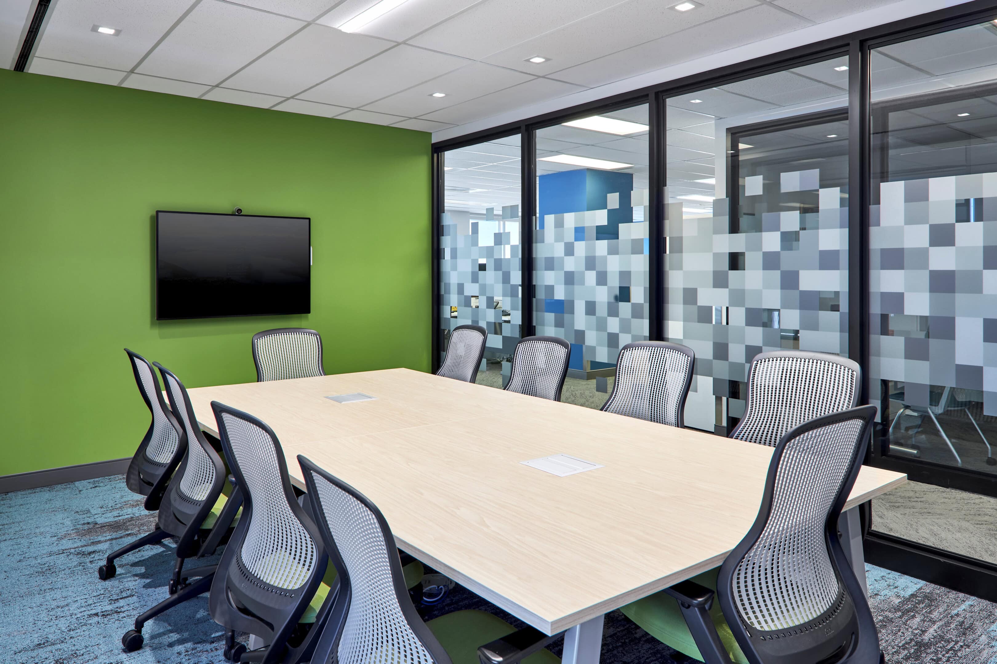 Glass-walled meeting room lighting at Patented Medicine Prices Review Board, Ottawa