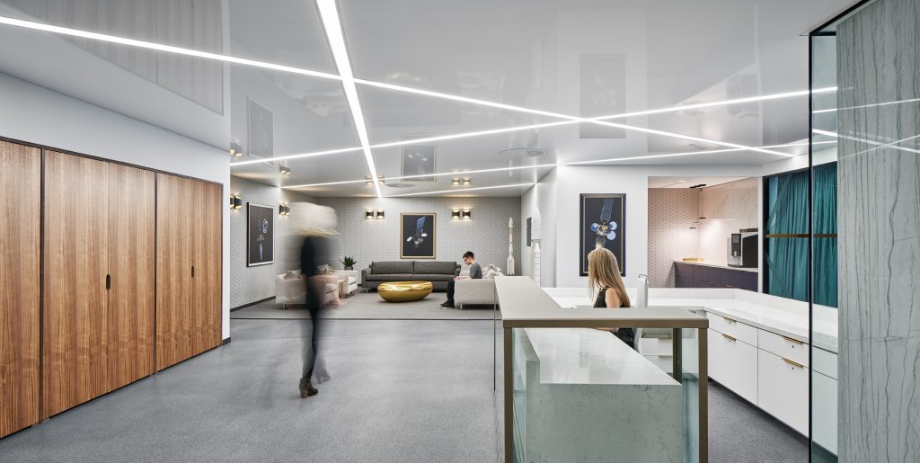 Cafe lighting with crossing linear ceiling fixtures at Telesat, Ottawa