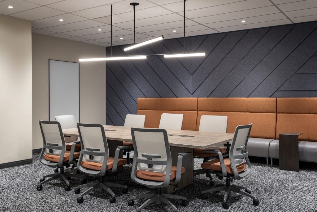 Boardroom pendant lighting over table with accent wall at FCAC, Ottawa