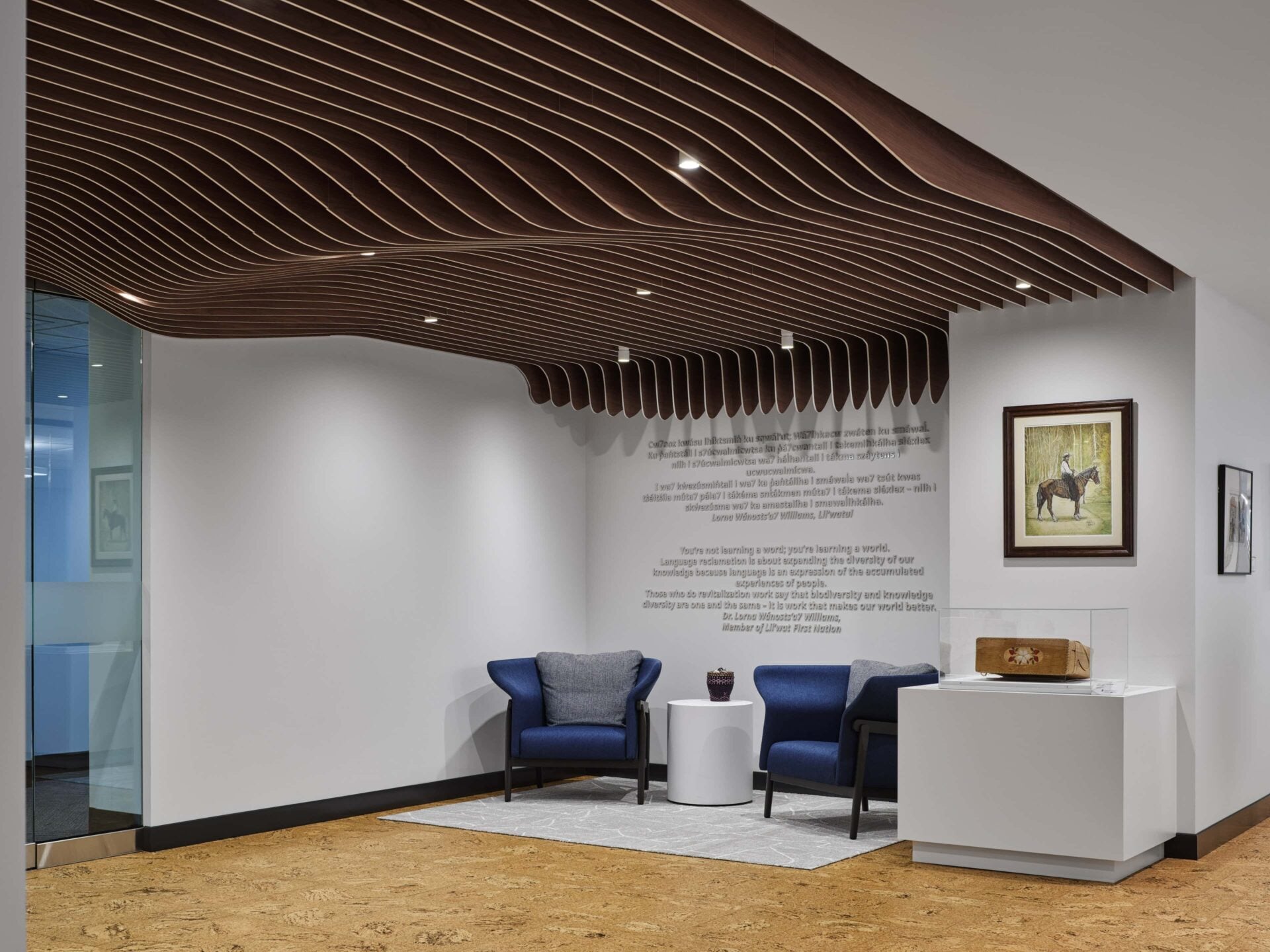Lounge lighting with wood ceiling feature at Office of the Commissioner of Indigenous Languages (OCIL), Ottawa