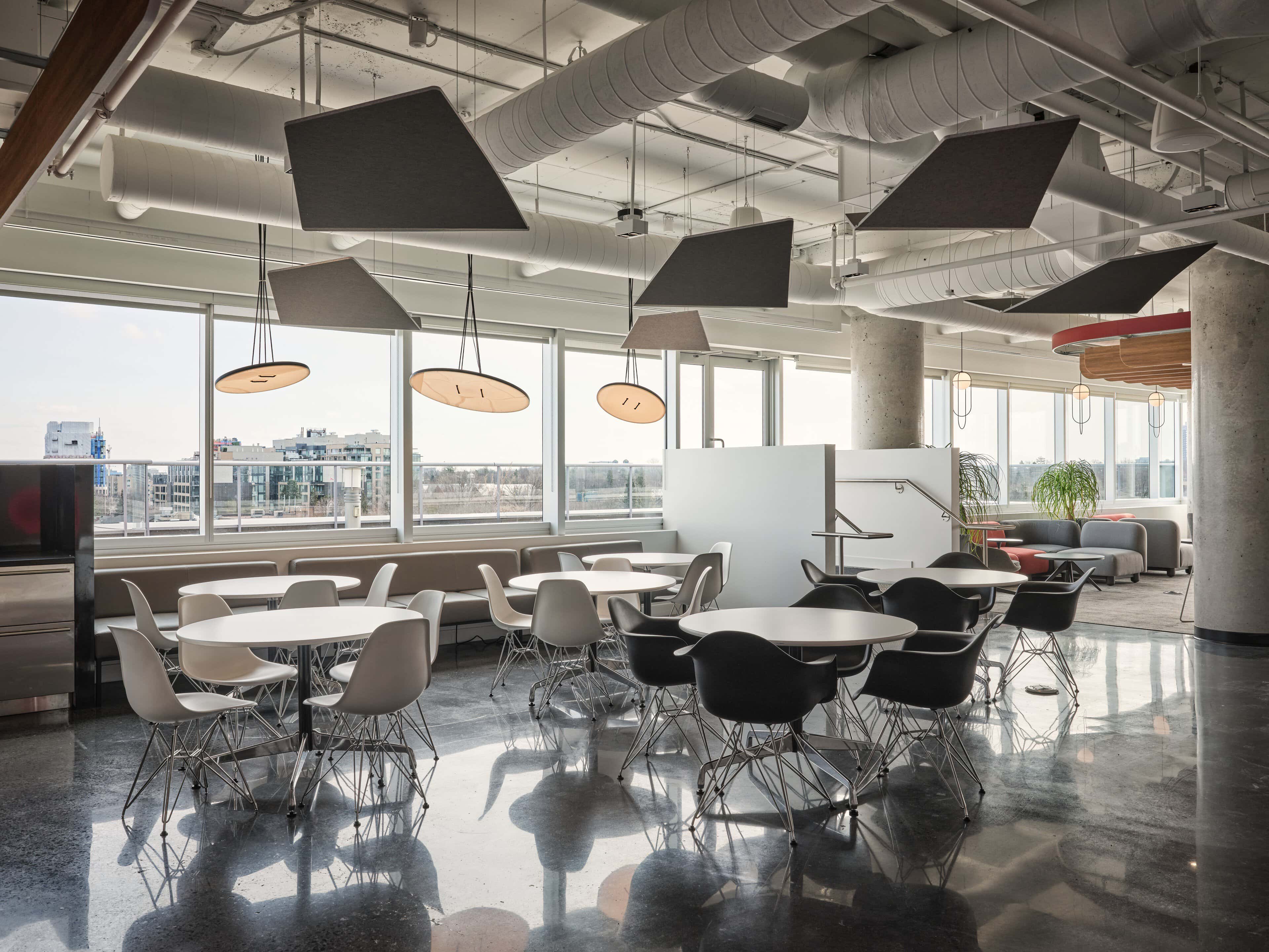 A-N-D Button pendants and suspended acoustic fins over the cafe tables at CIRA, Ottawa