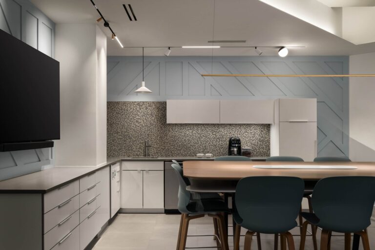 Flux Lighting showroom, Ottawa — a cooler contemporary kitchen on track lighting, with a lit backsplash.