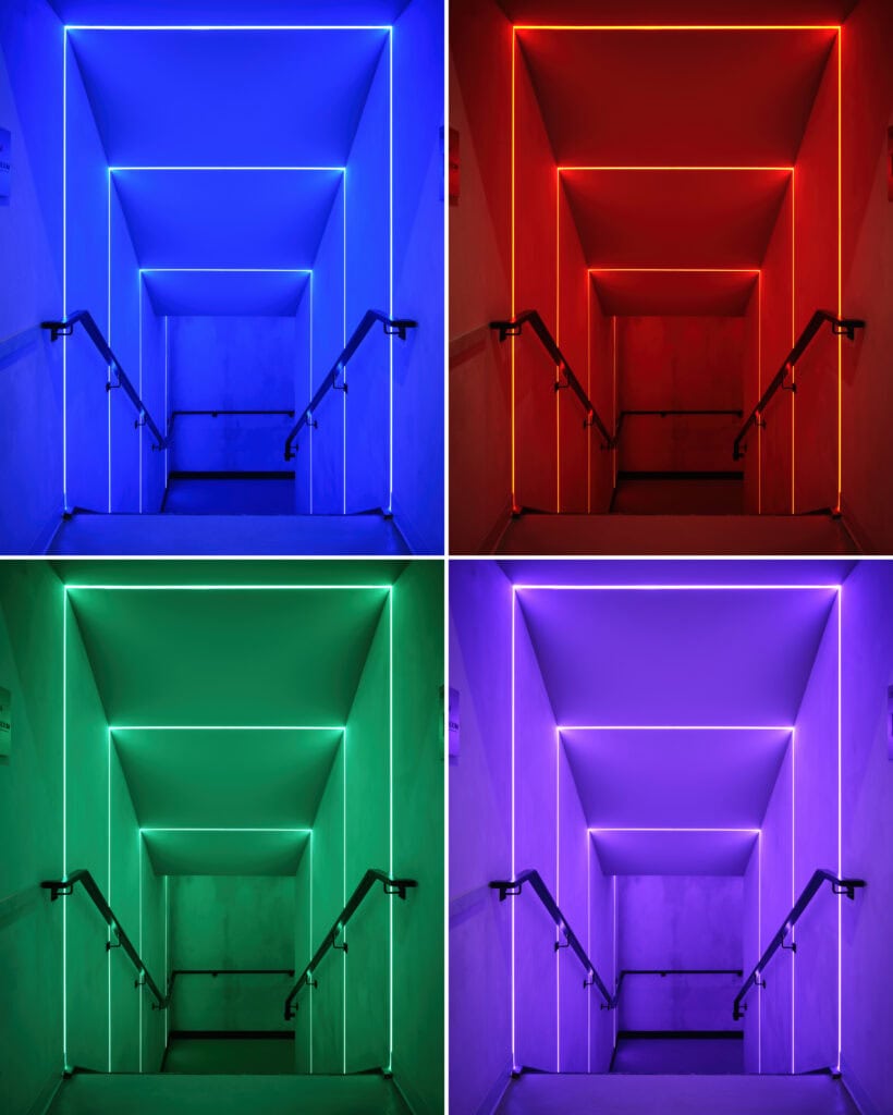 The colour-changing stairwell at HISTORY Ottawa in blue, red, green and violet, PureEdge TruLine RGBW runs photographed from one position